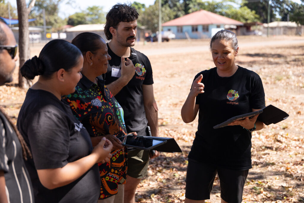 Mikaela and Lindsay from Indigital talking through the Lidar Scanning program with Aunty Melanie, Tanaya, and Tully during the Aurukun Masterclass