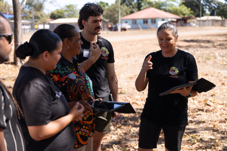 Mikaela and Lindsay from Indigital talking through the Lidar Scanning program with Aunty Melanie, Tanaya, and Tully during the Aurukun Masterclass