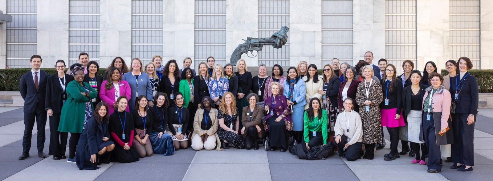 Group photo of Australia's delegation to the CSW68 outside in front of a building, smiling and looking at the camera.