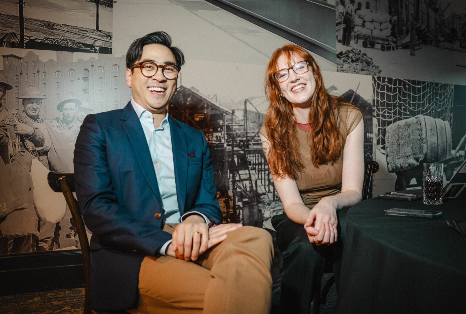 Michael Hing and Lou Wall smiling sitting down at the 2024 Diversity Debate