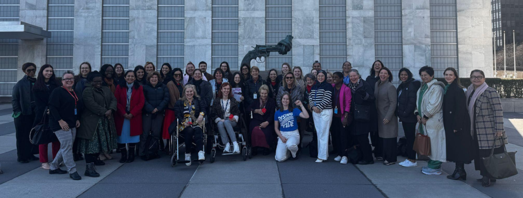 Australia's delegation to CSW69 standing in front of The Knotted Gun at the UN